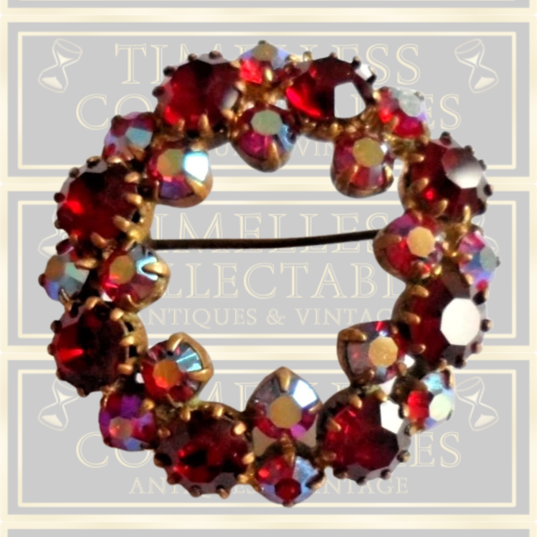 Vintage brooch claw set with red stones and Aurora Borealis stones