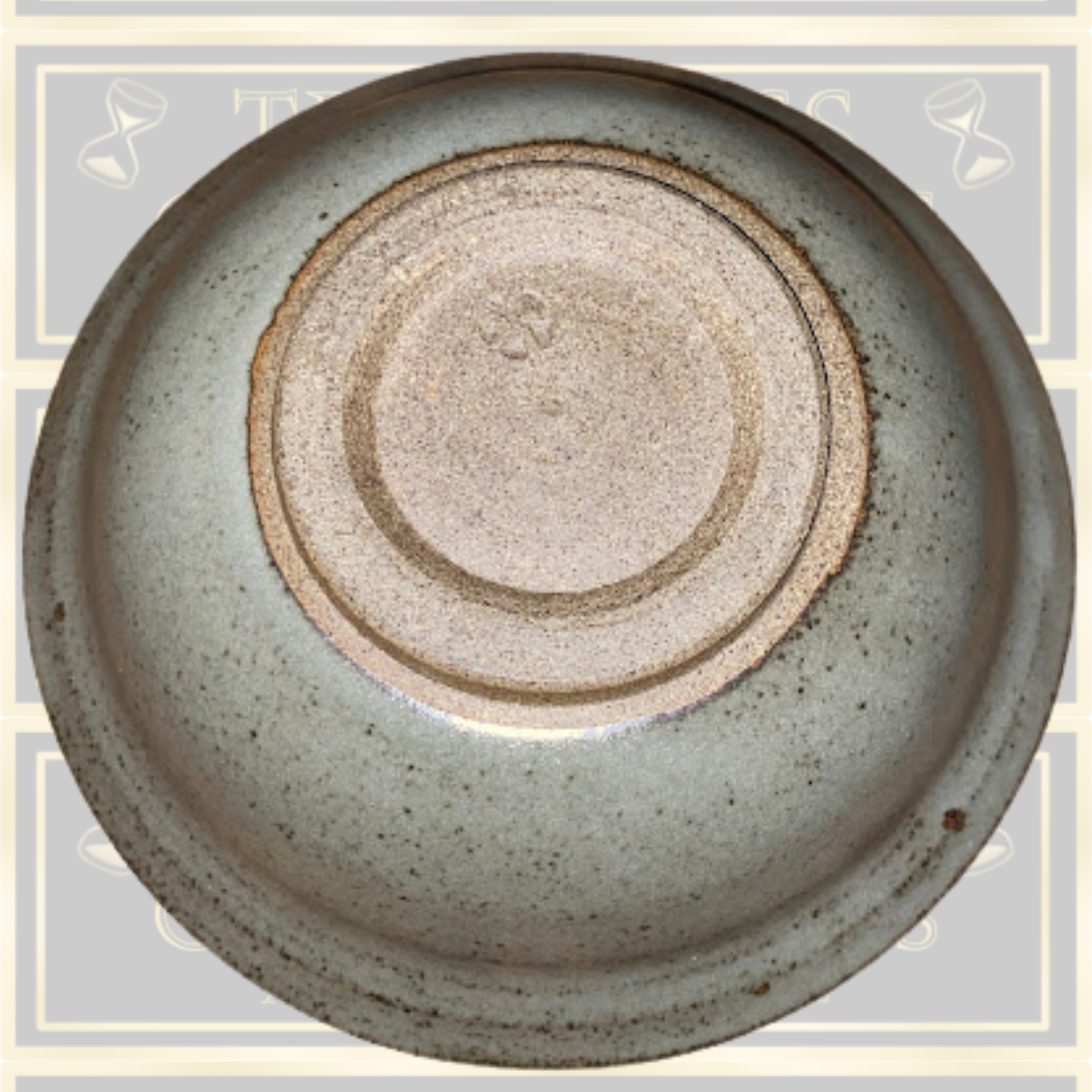 Stoneware Lidded Bowl Featuring a sculptural, animal-themed handle on the lid.