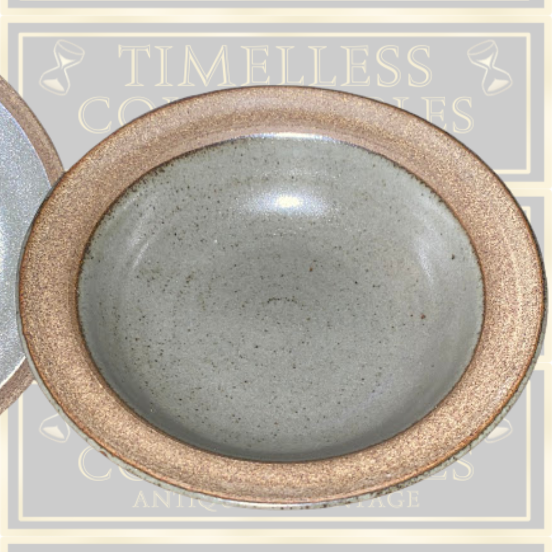 Stoneware Lidded Bowl Featuring a sculptural, animal-themed handle on the lid.