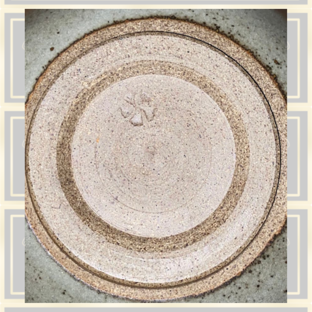 Stoneware Lidded Bowl Featuring a sculptural, animal-themed handle on the lid.