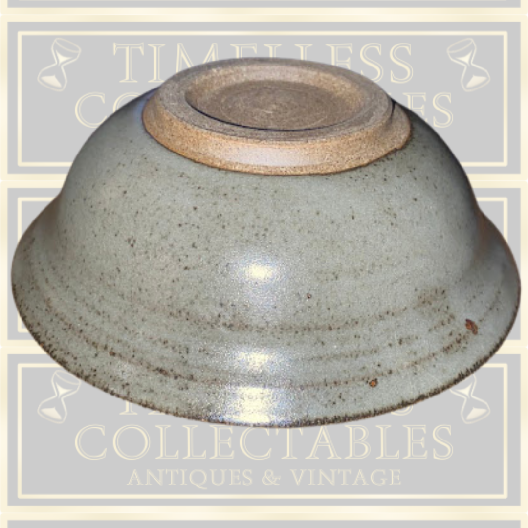 Stoneware Lidded Bowl Featuring a sculptural, animal-themed handle on the lid.