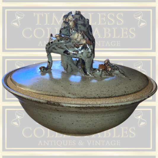 Stoneware Lidded Bowl Featuring a sculptural, animal-themed handle on the lid.