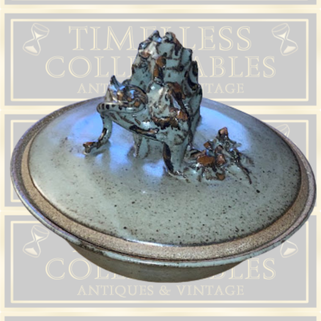Stoneware Lidded Bowl Featuring a sculptural, animal-themed handle on the lid.