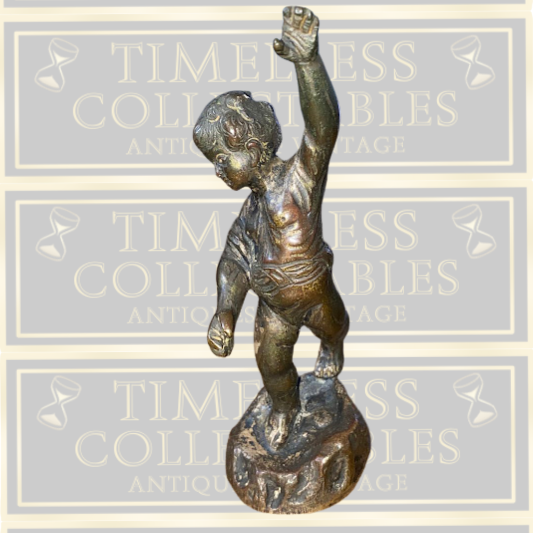 Antique bronze cherub figurine