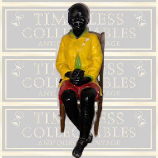 Antique Goldscheider Black Boy On A Wooden Chair