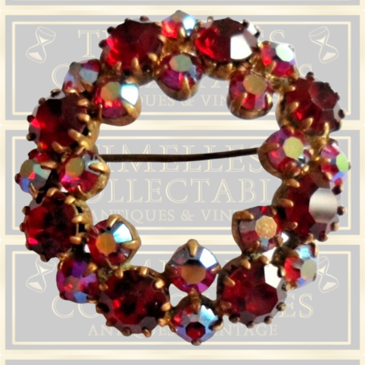 Vintage brooch claw set with red stones and Aurora Borealis stones