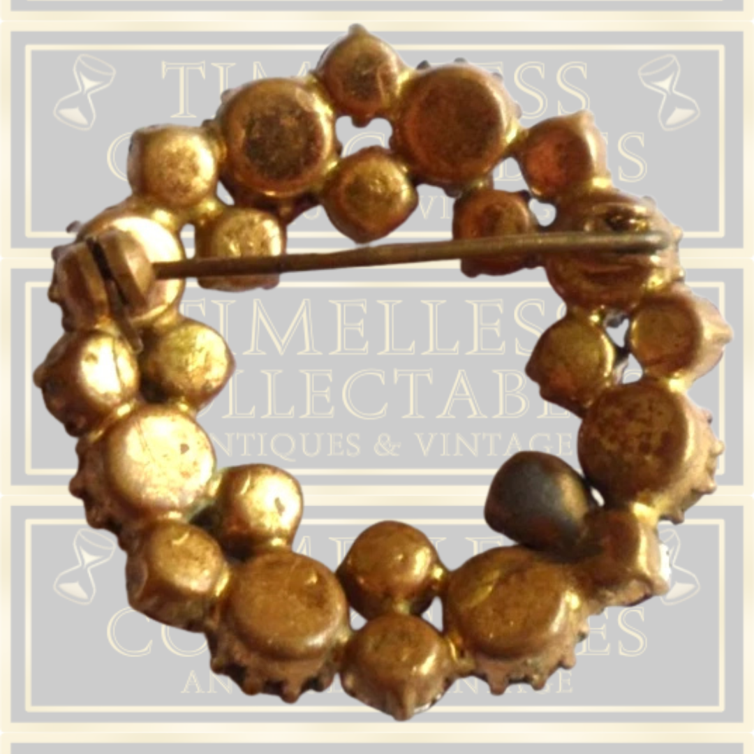 Vintage brooch claw set with red stones and Aurora Borealis stones