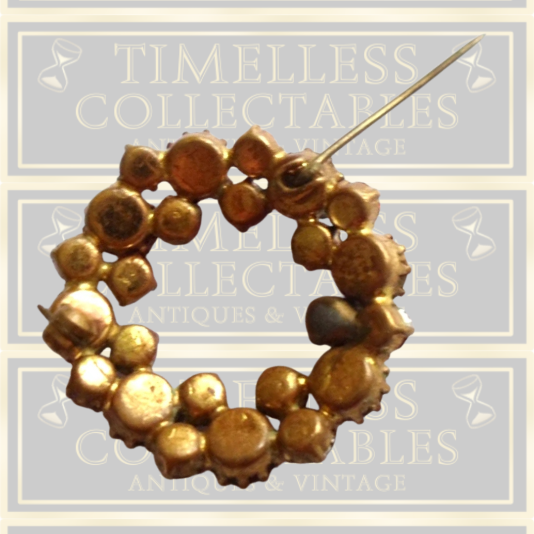 Vintage brooch claw set with red stones and Aurora Borealis stones